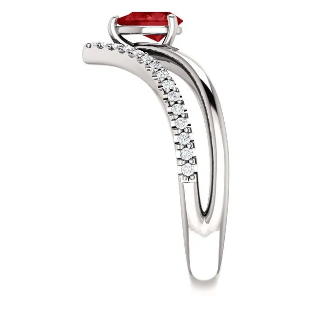 14KT GOLD 1/2 CT PEAR RUBY & 1/6 CTW DIAMOND NEGATIVE SPACE "V" RING