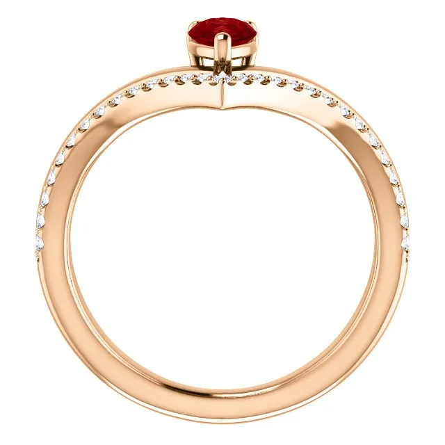 14KT GOLD 1/2 CT PEAR RUBY & 1/6 CTW DIAMOND NEGATIVE SPACE "V" RING
