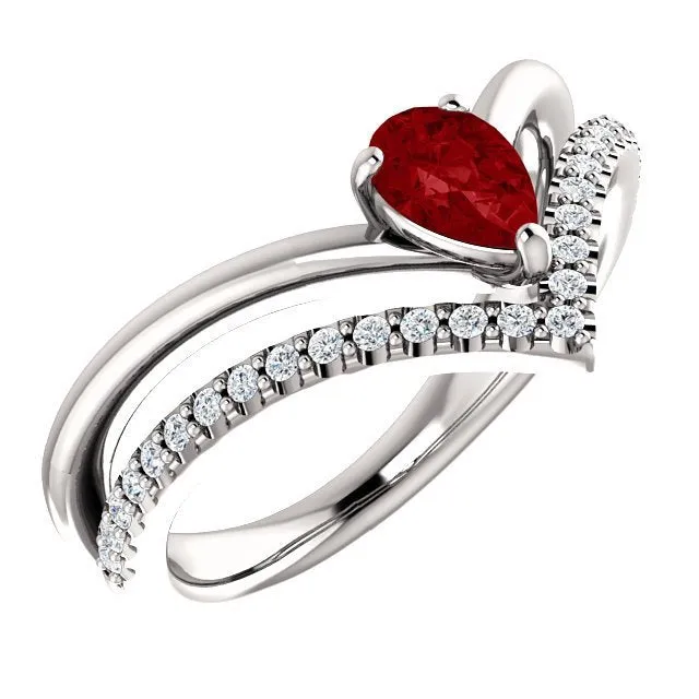 14KT GOLD 1/2 CT PEAR RUBY & 1/6 CTW DIAMOND NEGATIVE SPACE "V" RING