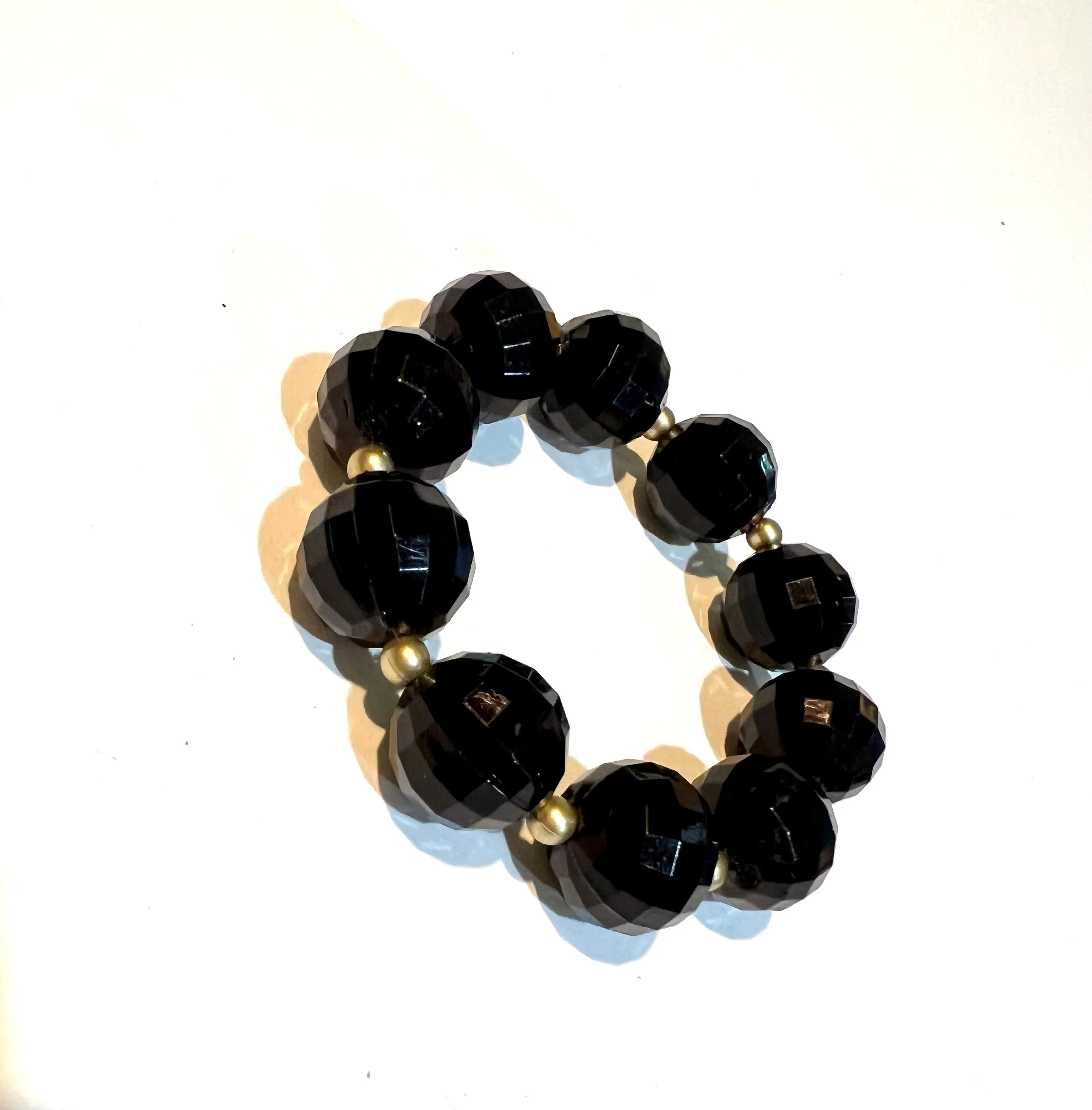 Elegant Black Crystal-Inspired Stretch Bracelet with Golden Spacers
