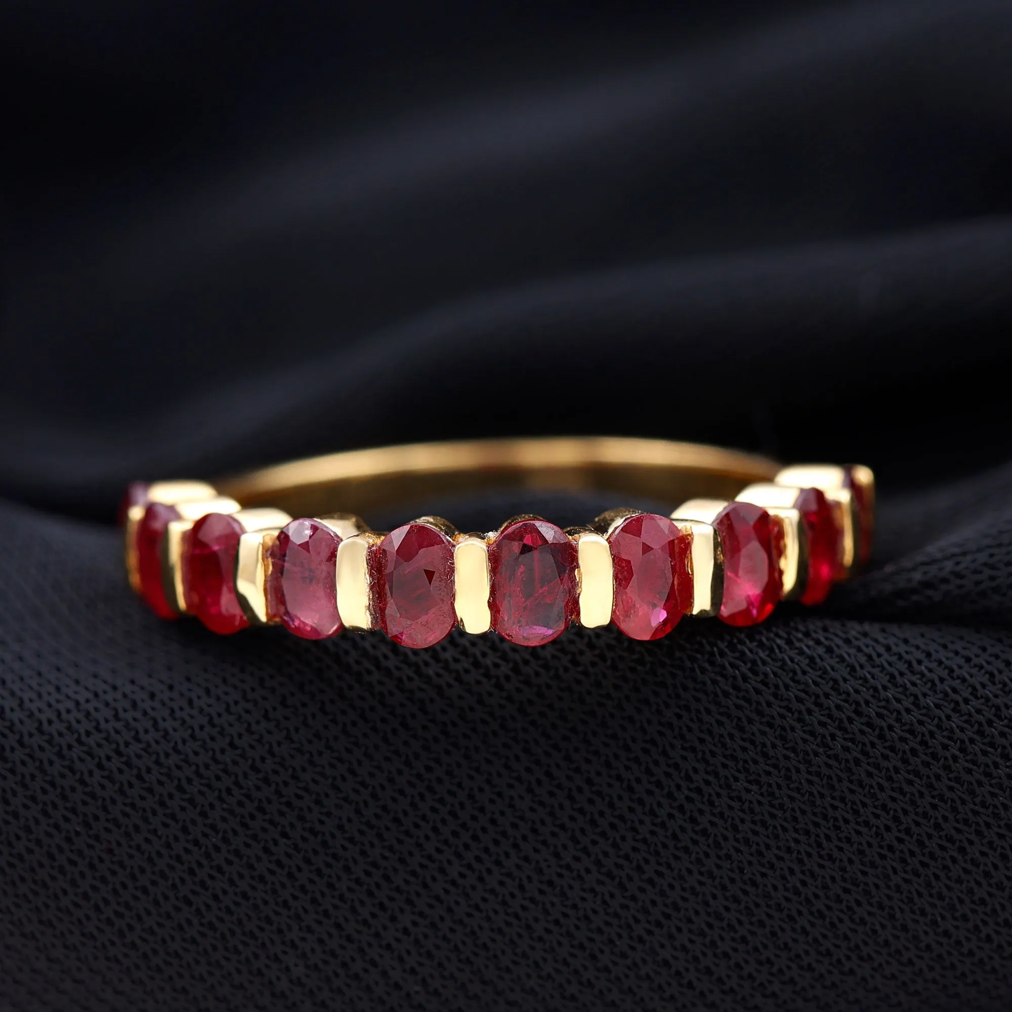 Oval Cut Created Ruby Half Eternity Ring in Bar Setting