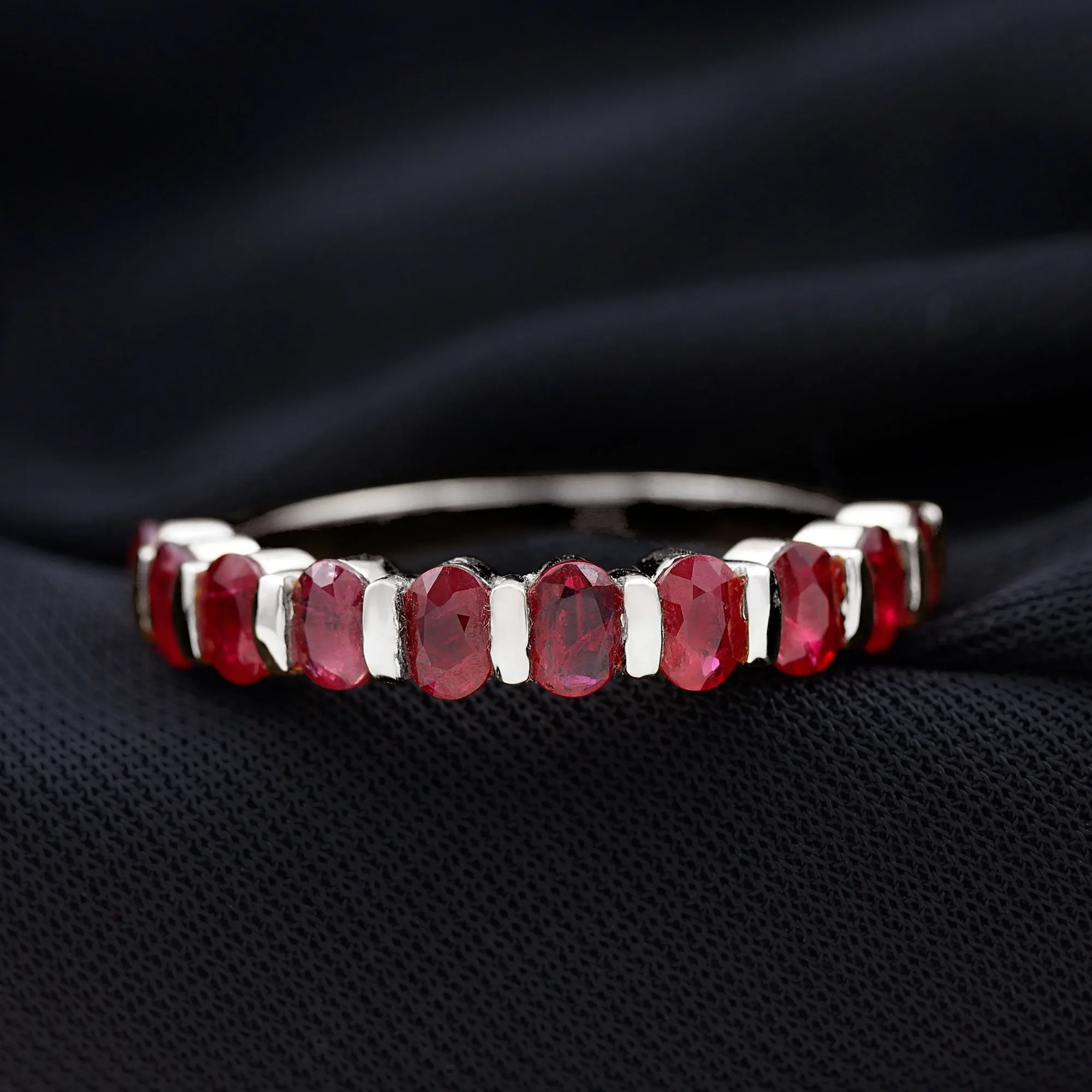 Oval Cut Created Ruby Half Eternity Ring in Bar Setting