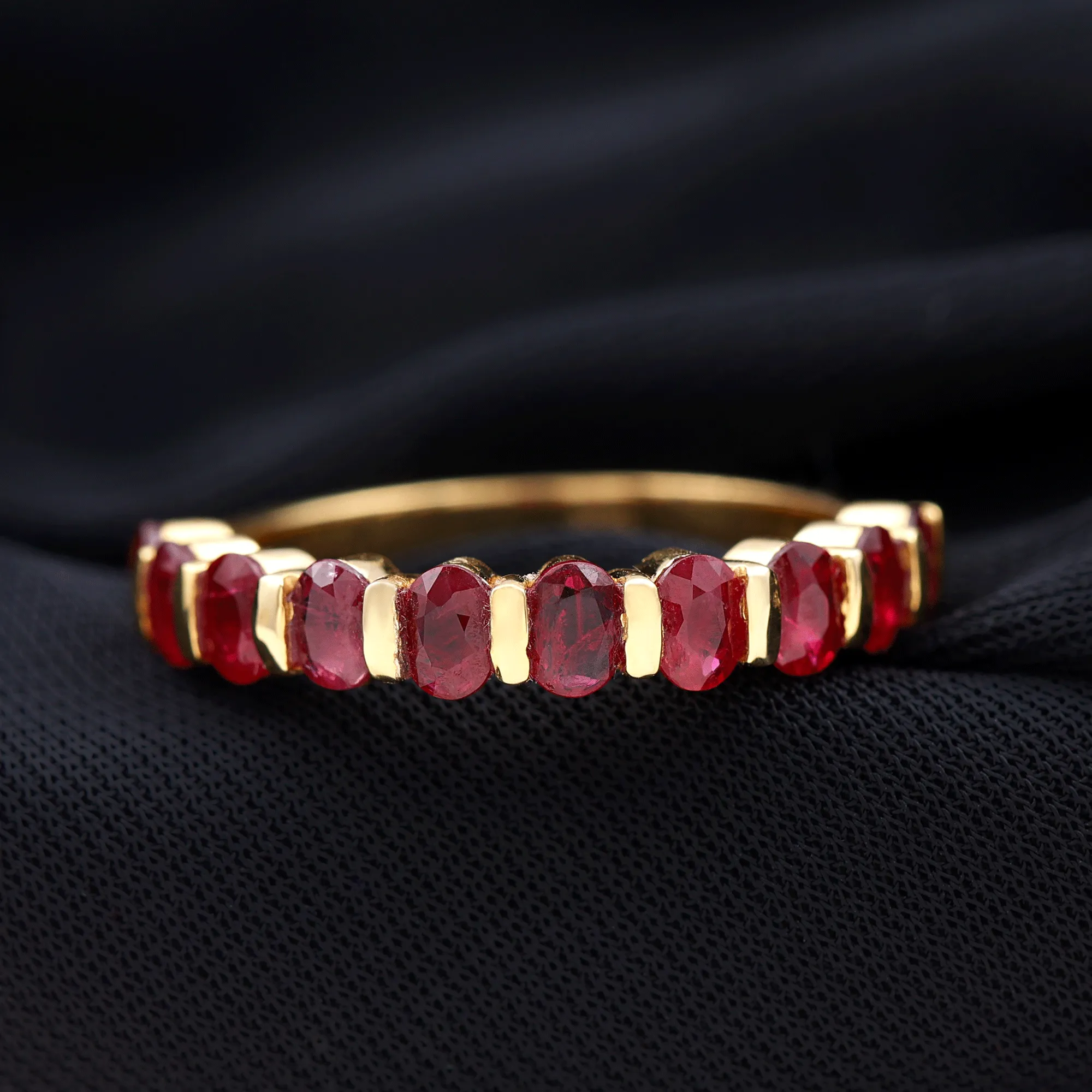 Oval Cut Created Ruby Half Eternity Ring in Bar Setting