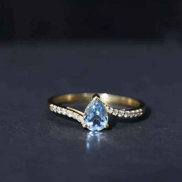 Pear Cut Aquamarine Solitaire Ring with Diamond Bypass Shank